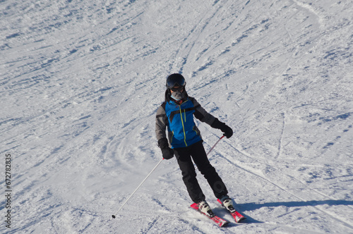 Skier on the snowy slope photo