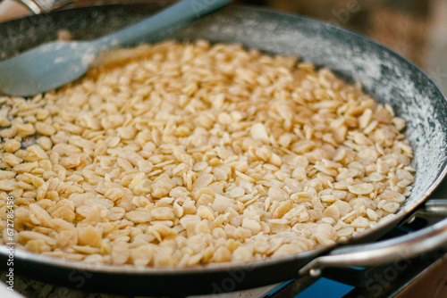 Almond slivers in a skillet, perfect for culinary blogs and recipe content.
