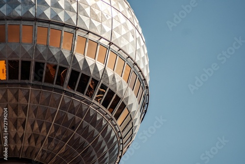 the top of an industrial tower  with a mirror in it