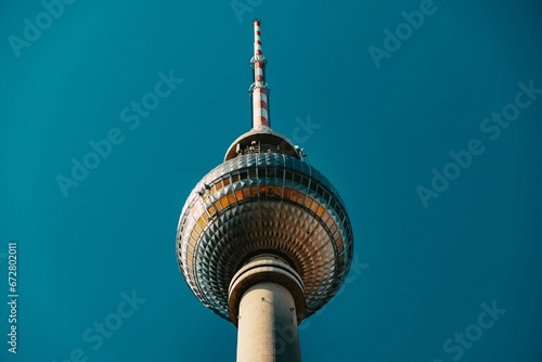Tall television tower on the backdrop of a blue sky