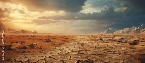 Cloudy Skies over Parched Desert Landscape. Overcast sky casting shadows on a dry cracked desert.