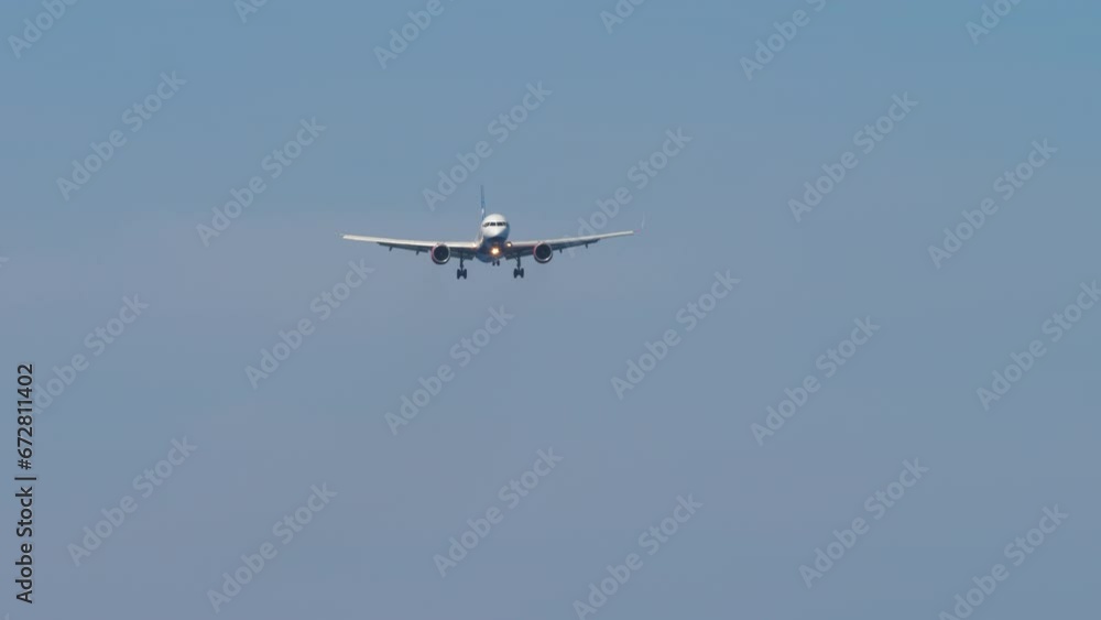 Jet plane in the sky. Airplane approaching to land. Commercial plane flies. Travel and tourism concept Jet plane in the sky. Airplane approaching to land. Commercial plane flies. Travel and tourism concept