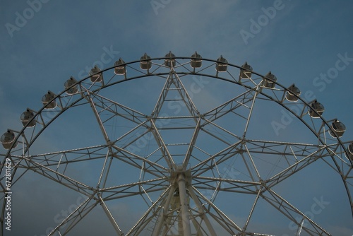 Low angle shot of a Ferris wheel against the sky