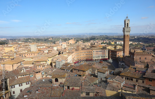 tower called Torre del Mangia and panorama of the city of Siena in Tuscany in Italy