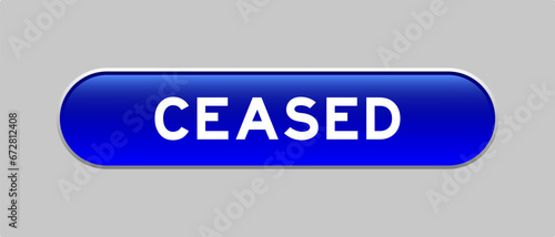 Blue color capsule shape button with word ceased on gray background
