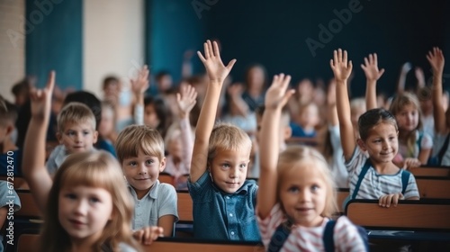 Students raise their hands to answer in the classroom. education and school concept