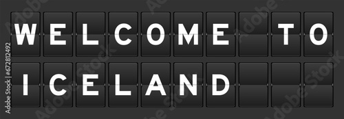 Black color analog flip board with word welcome to iceland on gray background