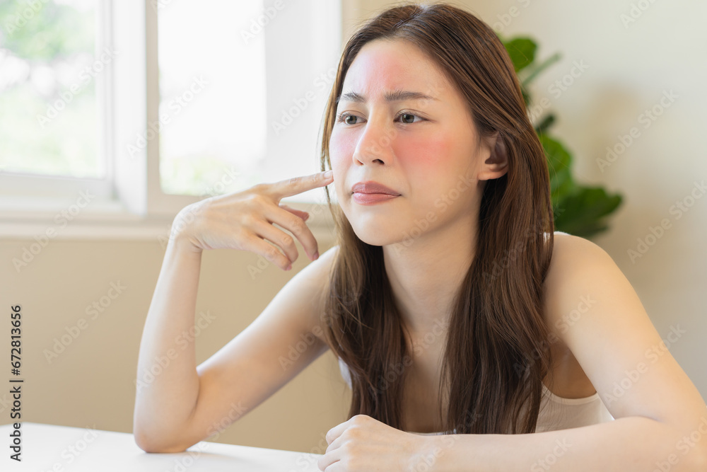 Dermatology, puberty asian young woman, girl looking into mirror, allergy presenting an allergic reaction from cosmetic, red spot or rash on face. Beauty care from skin problem by medical treatment. Dermatology, puberty asian young woman, girl looking into mirror, allergy presenting an allergic reaction from cosmetic, red spot or rash on face. Beauty care from skin problem by medical treatment.
