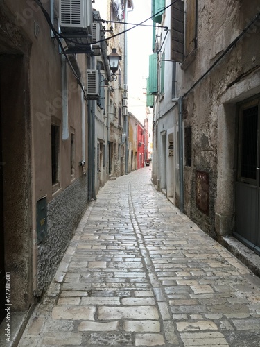 Picturesque alleyway between two buildings in a town or city  leading into the unknown