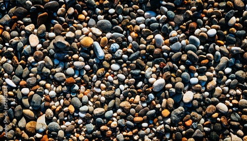 Colorful sea stones on the beach texture background