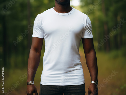 A young black male (African American) model wearing a white t-shirt, no face, mockup, in an outdoor setting, © JQM
