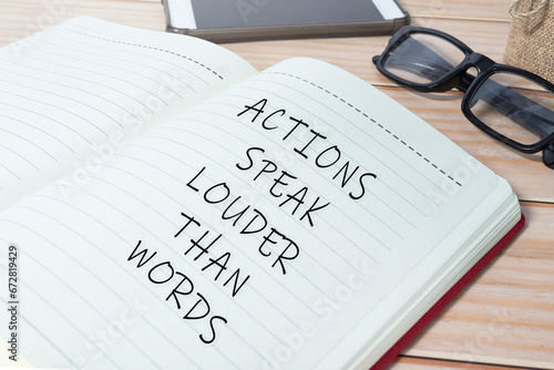 Actions speak louder than words text on notepad. Business concept.