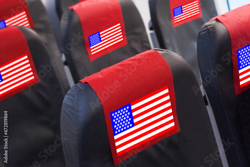 Empty seat in plane with American Flag. Travel, flight and transportration in US concept