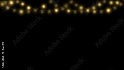 Christmas lights garland on black background. Glowing gold light bulbs. Xmas, New Year, wedding or Birthday decor. Party event decoration. Winter holiday season element. photo