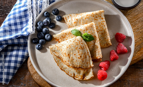 A plate of pancakes filled with sweet cottage cheese photo