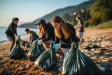 Volunteers collecting garbage on the beach. Group of young people sorting garbage on a beach.