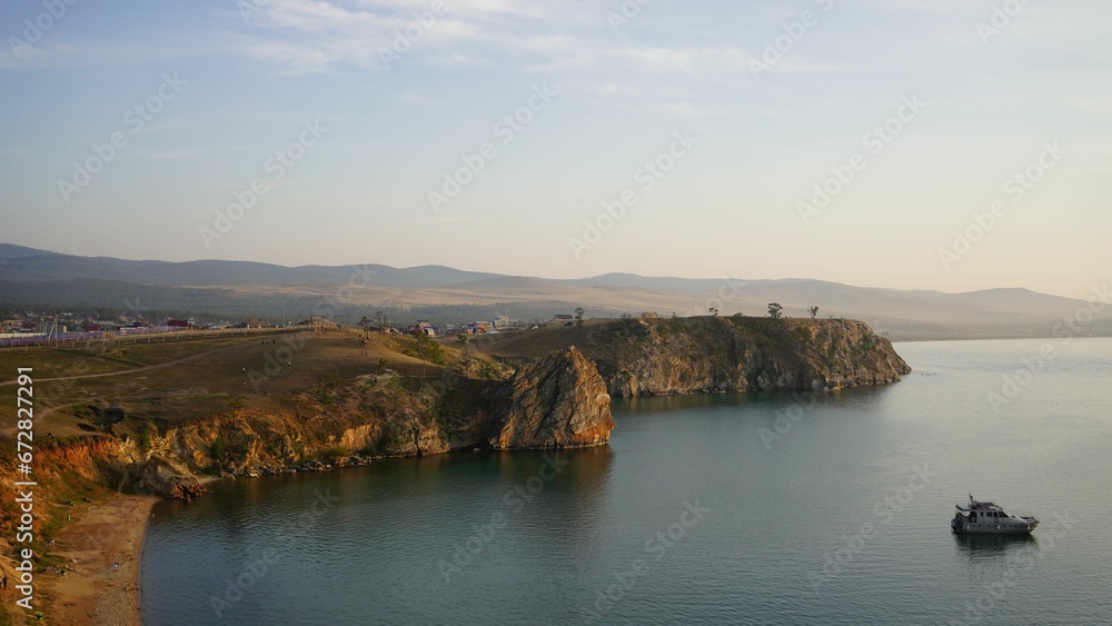 Landscape of the sea surrounded by cliffs and greenery in the morning