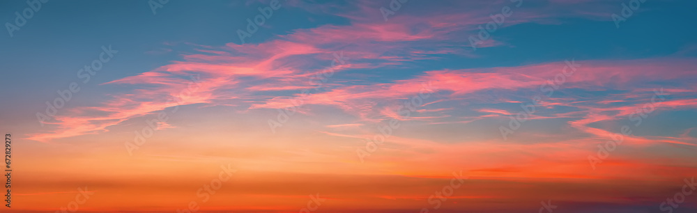Sunset sky background in the evening with colorful sunlight clouds after sundown