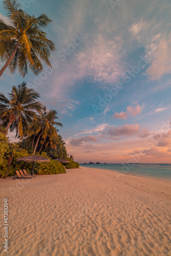 Amazing tropical sea beach serene sky sand sunset light. Relax paradise horizon coco palm trees and calm sea. Romantic vacation seaside beach best coast nature. Gorgeous landscape, stunning sky view