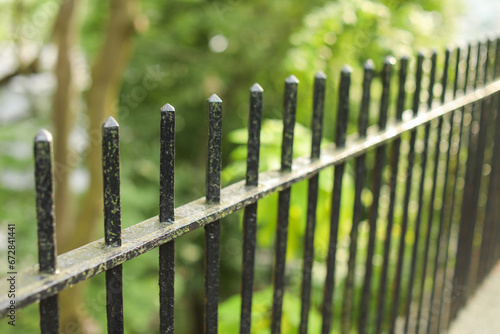 metal fence in golden sunset light, offering security and charm to a countryside landscape