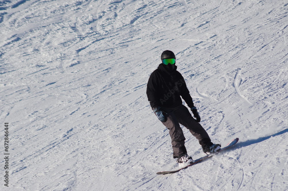 Snowboarder on the snowy slope