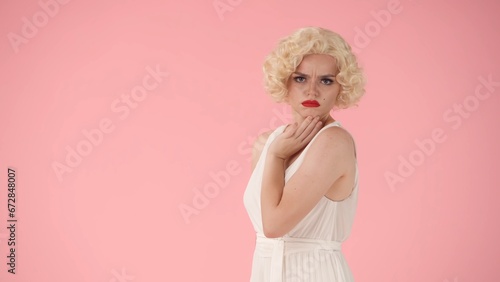 Photography Side view of an offended young woman with pouting lips