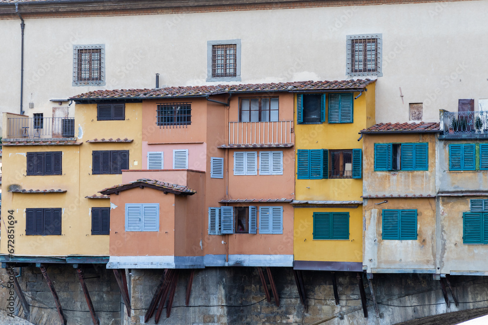 Exterior houses and windows on ponte vecchio bridge in Florence, Italy