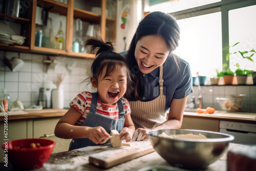 A view of a asian parent and child engaged in a fun cooking or baking activity, illustrating the joy of culinary bonding, selective focus, shallow depth of field, blurred photo