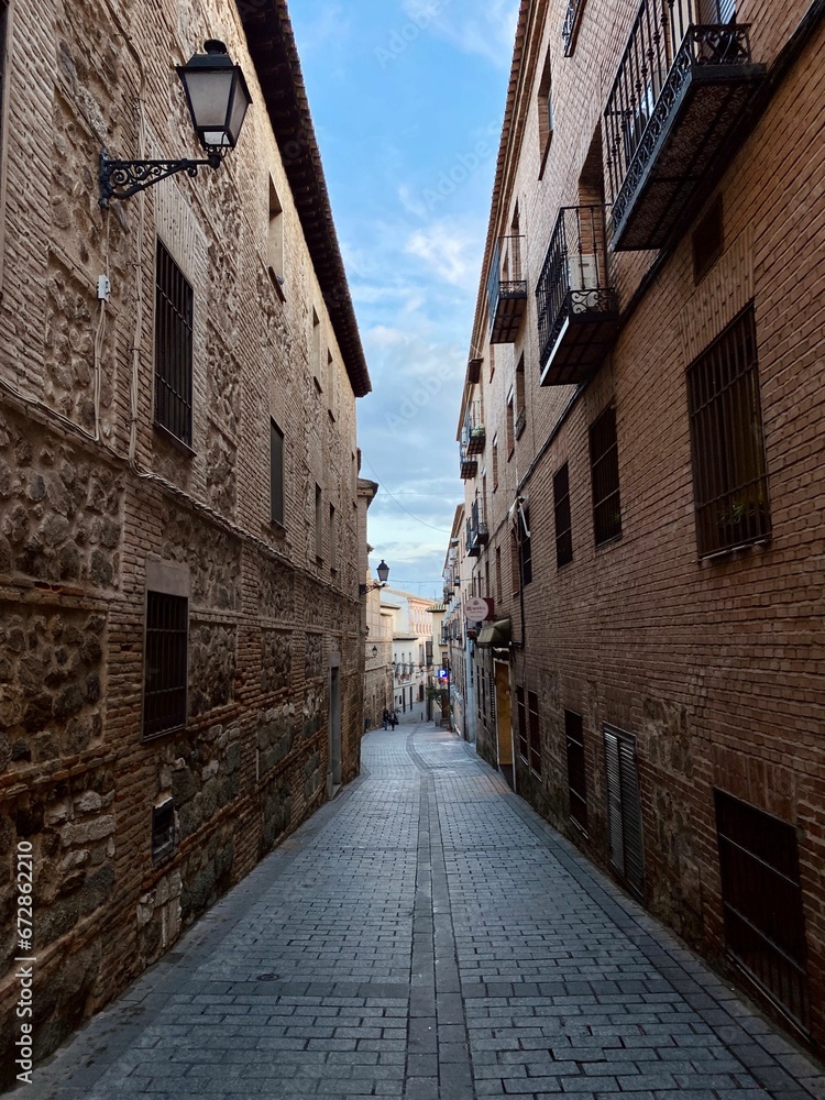 Picturesque view of a quaint, narrow cobblestone street.
