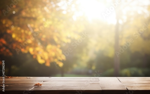 Wooden table and blurred Autumn background. Autumn yellow leaves banner