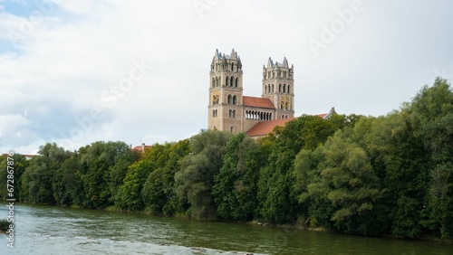 Majestic St. Maximilian in Munich church near the Isar River surrounded by trees