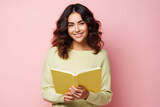 Portrait of cute cheerful person toothy smile hold read opened book isolated on pink color background