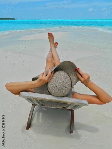 the legs and legs of a person are shown on a beach chair