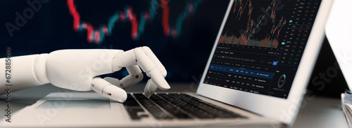 Automated stock trading concept. Robotic hand analyzing financial data on stock exchange, artificial intelligence utilization to predict precise price change in stock market. Trailblazing photo