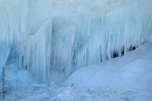 Natural wallpaper magical ice of Lake Baikal icicles and alluviums.