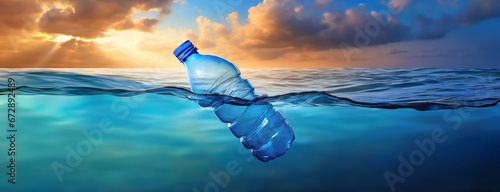 a discarded plastic rubbish bottle floats on ocean water surface on a presenting a hazard to all marine life