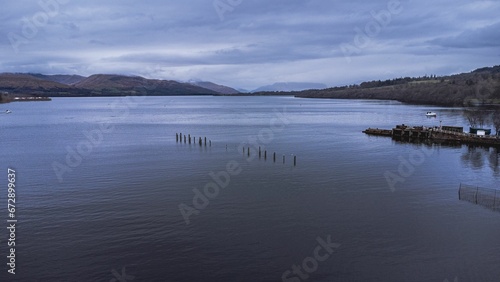 Aerial of a pier on a cloudy day in Loch Lomond  Scotland