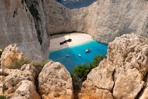 Scenic Navajo beach in Greece with an azure blue sea, crystal clear white sand