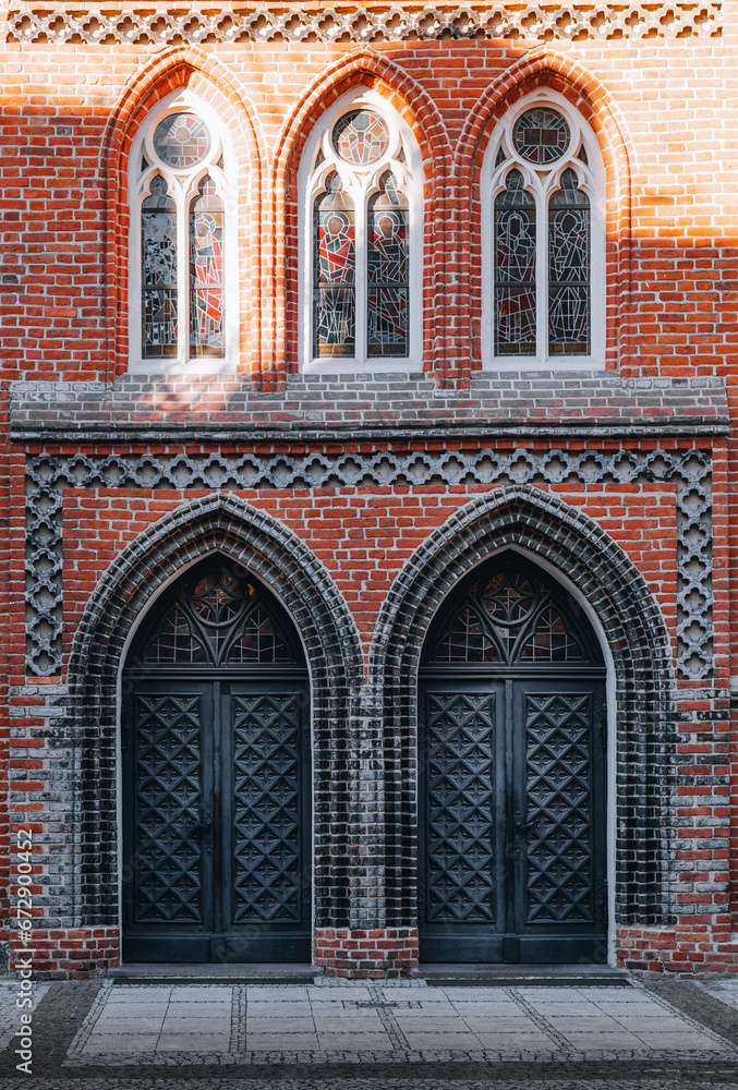 two side entrances to the gothic catholic church 