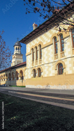 a view of an old school building and its clock tower