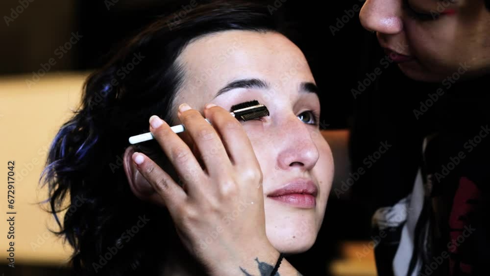 young woman holding mascara apply on eyeleashes prepare getting ready in the morning, smiling beautiful girl doing make up put cosmetics and lipstik on face looking in mirror in dressing room young woman holding mascara apply on eyeleashes prepare getting ready in the morning, smiling beautiful girl doing make up put cosmetics and lipstik on face looking in mirror in dressing room