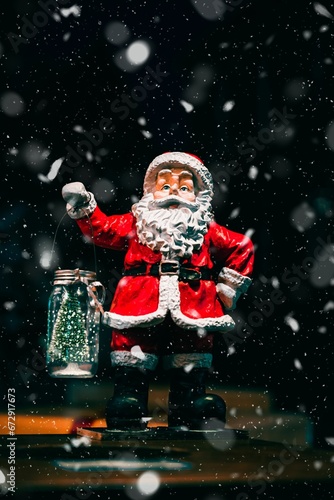 Cheerful Santa Claus statue is standing in a bustling Christmas market in Osnabruck