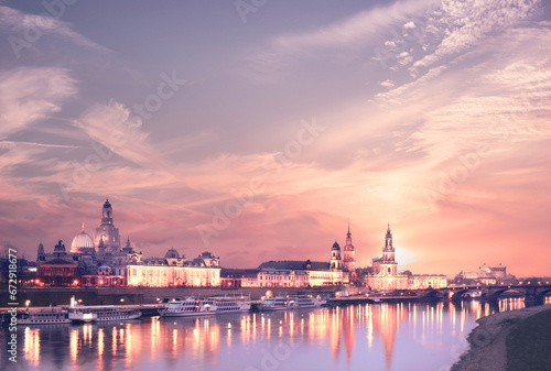 Sunset panorama of Dresden Old town with reflections in Elbe river and passenger ships
