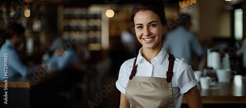 A cafe server firmly grasping a hot cup of coffee photo