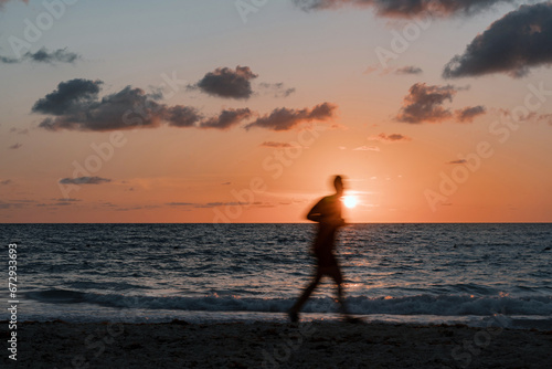 Sunrise Stride: A Jogger's Journey Along the Beach