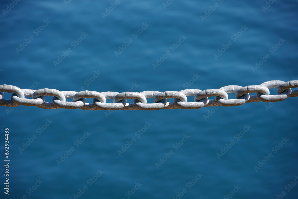 Heavy chain fence at a lake side Heavy chain fence at a lake side