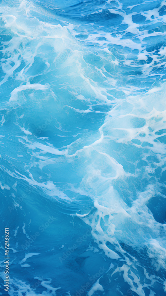 Blue and crystalline water. Waves in the ocean. View from above. Textured background. Blue and crystalline water. Waves in the ocean. View from above. Textured background.