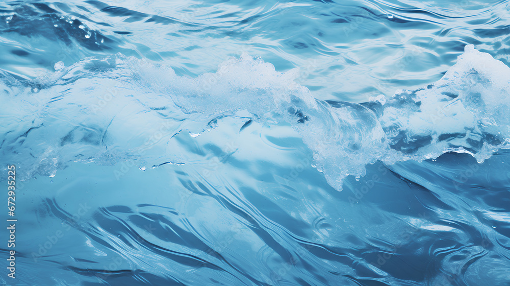 Blue and crystalline water. Waves in the ocean. View from above. Textured background.