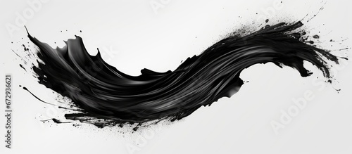 A stroke of black mascara on a white background separated from the rest