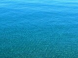Blue sea water rippled calm surface.